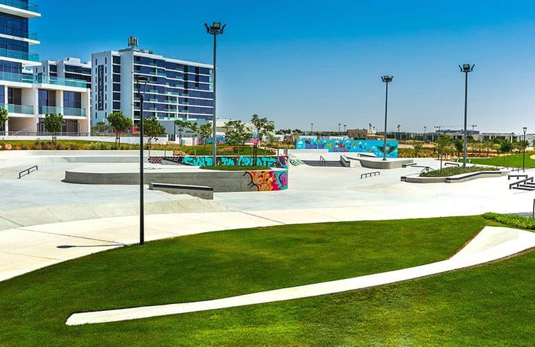 Skate park, lawns and apartment buildings in DAMAC Hills, Dubai