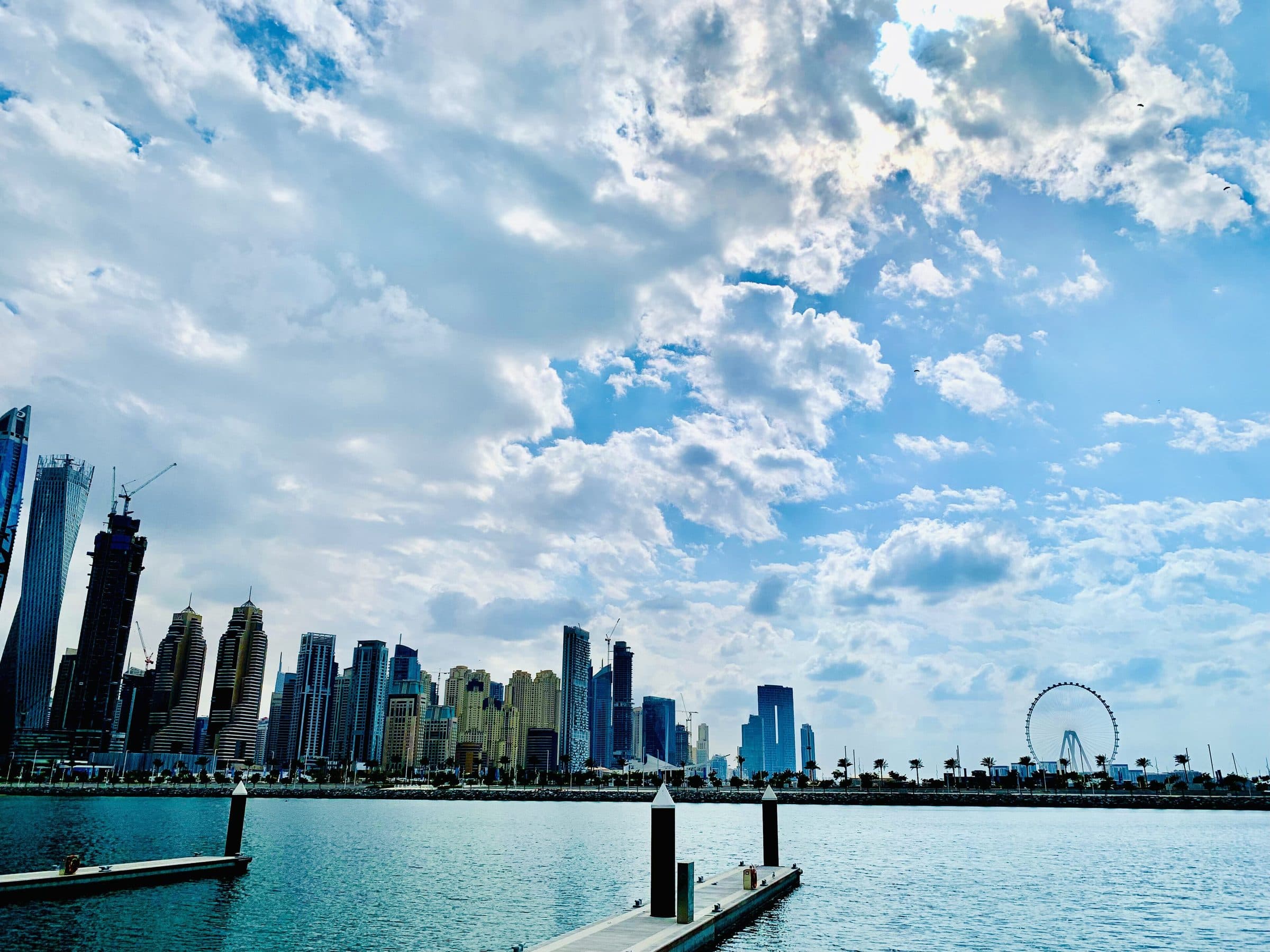 Dubai Marina towers and the Ain Dubai wheel seen from the marina berths at Dubai Harbour