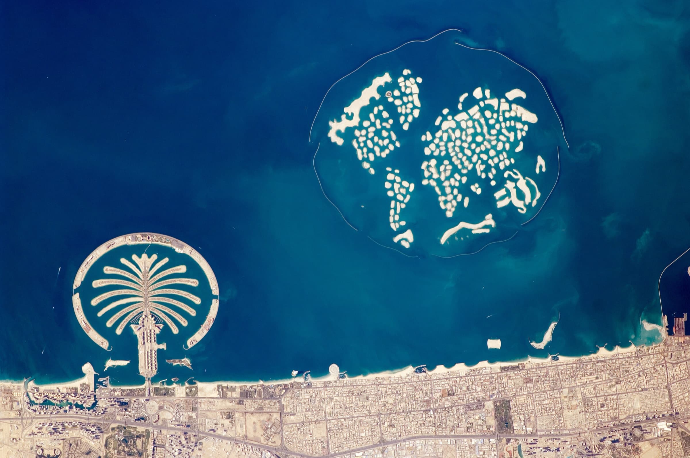 Aerial astronaut photograph of Palm Jumeirah and The World islands off the Dubai coast