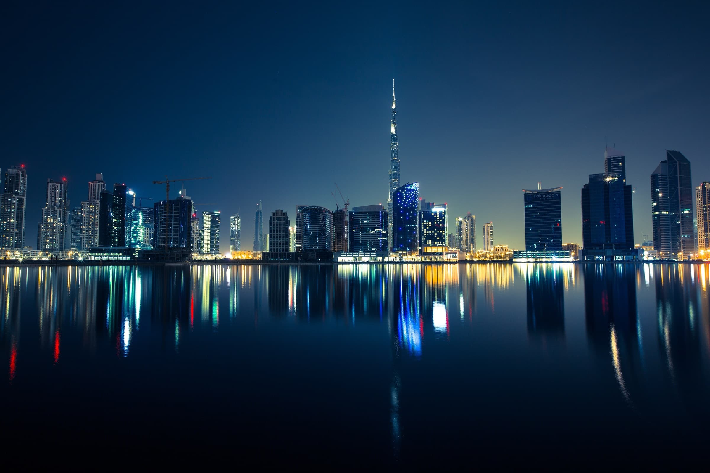 Dubai skyline at blue hour with the Burj Khalifa and Business Bay towers